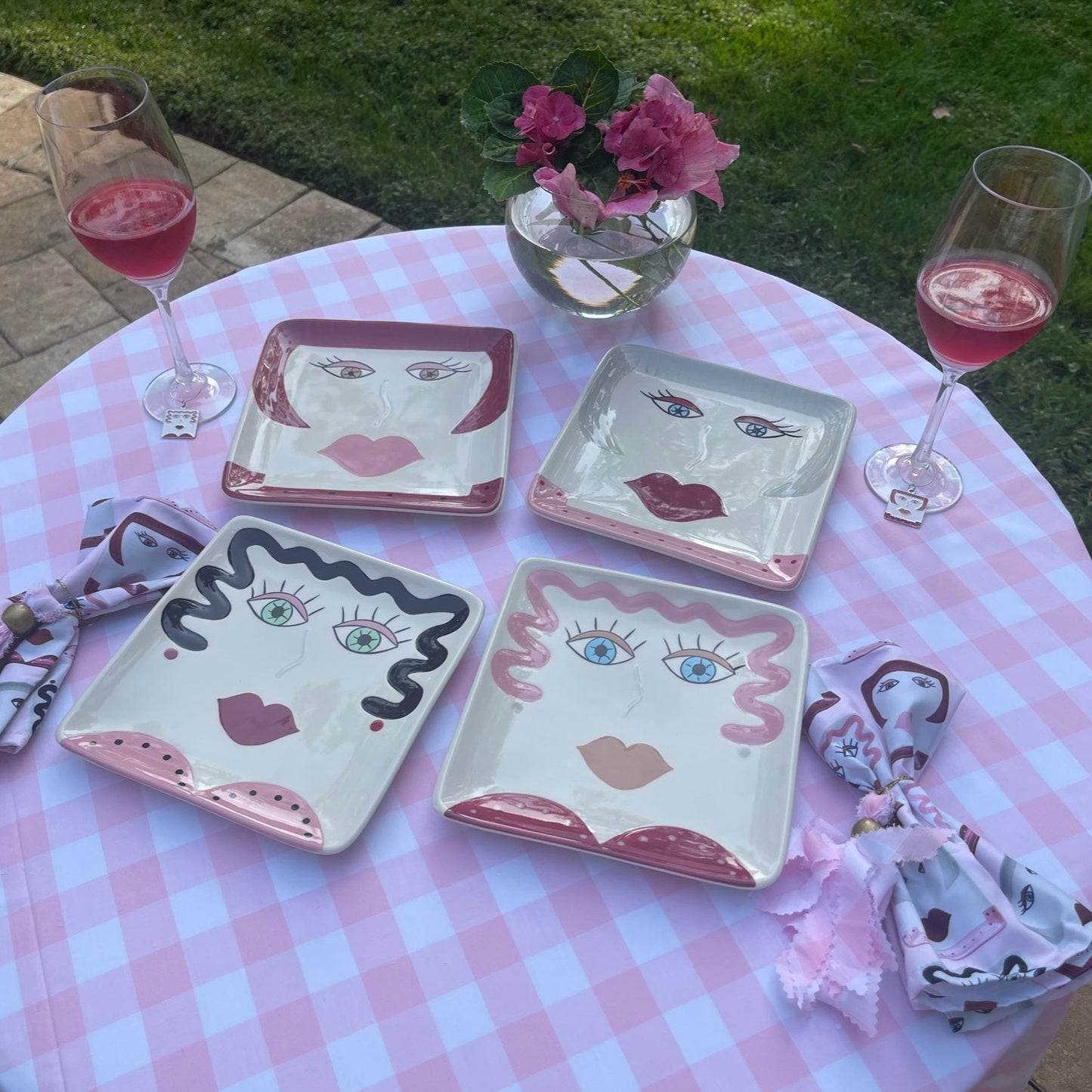 A tablescape with the pink personality plates that are perfect for pink aesthetic or motif. They are also face plates.